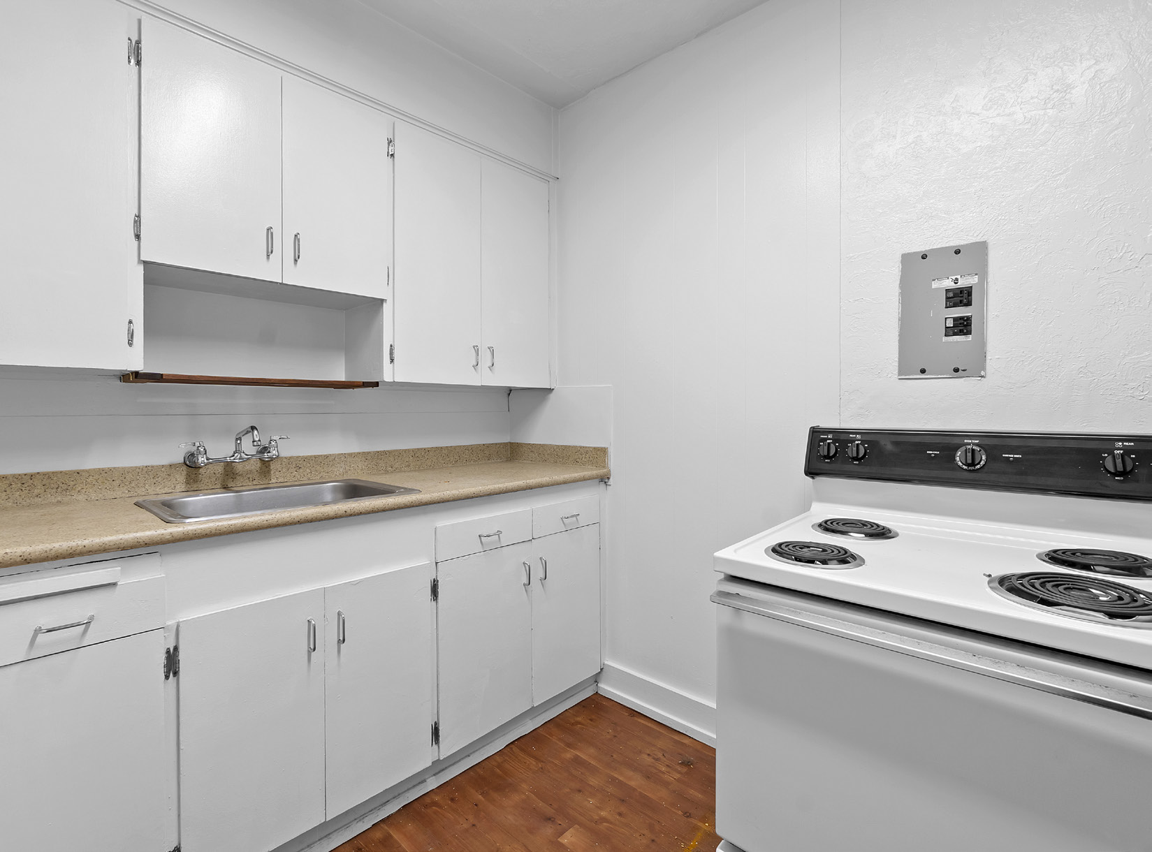 Kitchen with white cabinets and hardwood floors